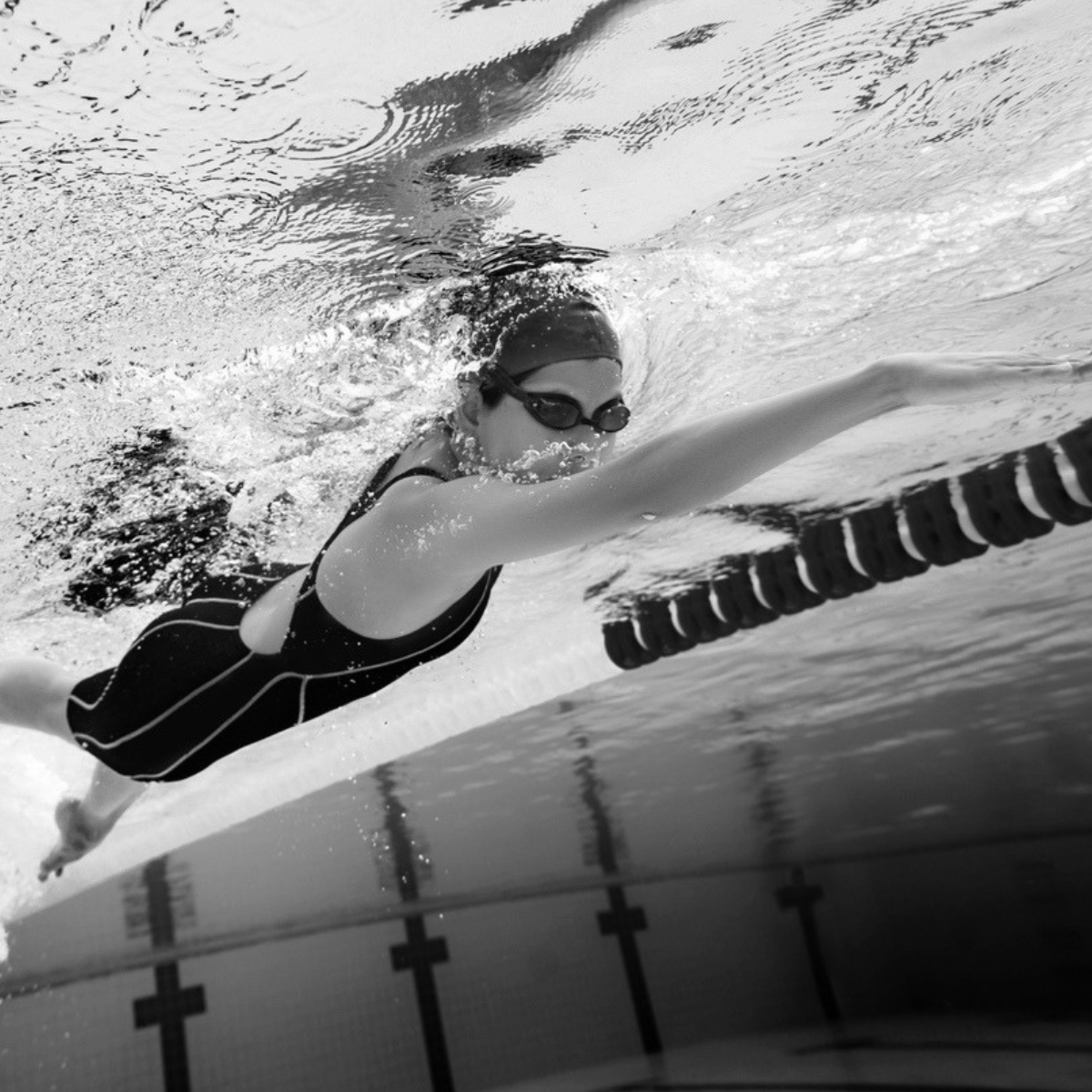 adolescent female athlete swimming